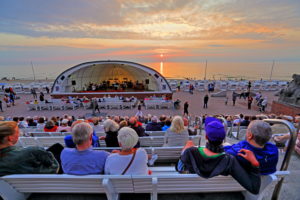 Beach promenade with concert in the Musikmuschel, Westerland, North Sea island, Sylt, North Frisian Islands, North Frisia, Schleswig-Holstein, Germany, sunset Beach promenade with concert in the Musikmuschel, Westerland, North Sea island, Sylt, North Frisian Islands, North Frisia, Schleswig-Holstein, Germany, sunset